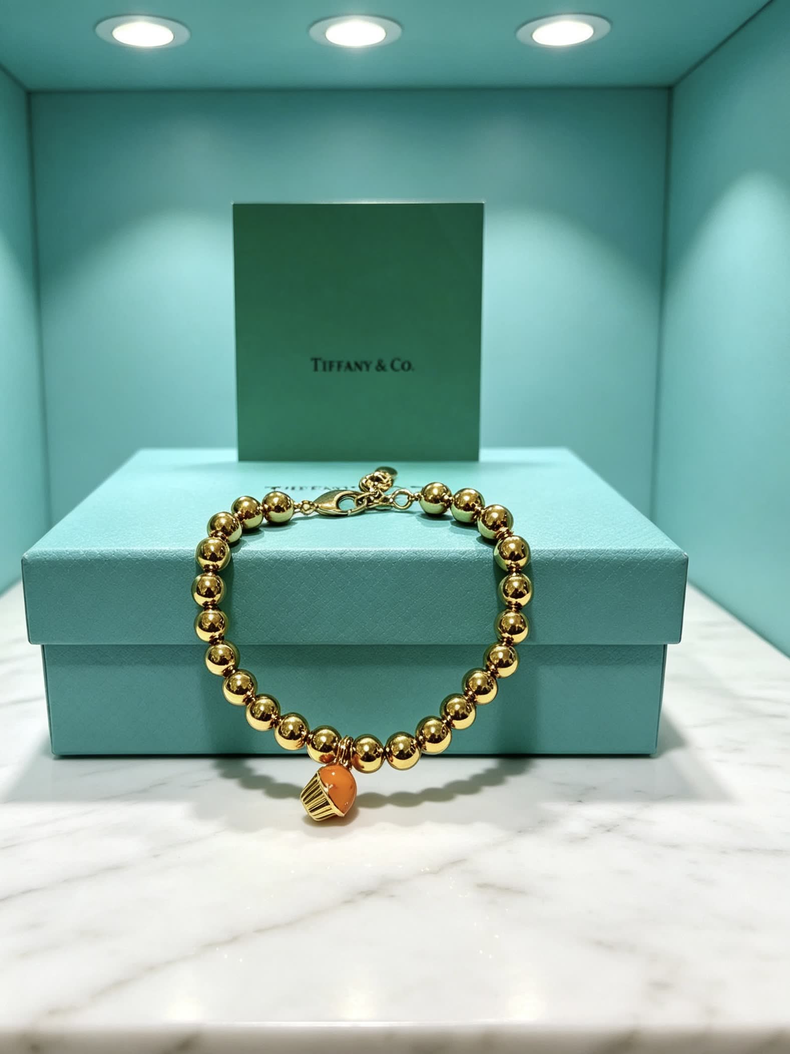 Tiffany & Co. Gold Bead Bracelet with Cupcake Charm